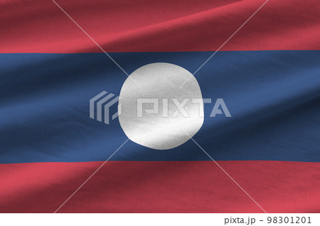 Laos flag with big folds waving close up under the studio light indoors. The official symbols and colors in banner 98301201
