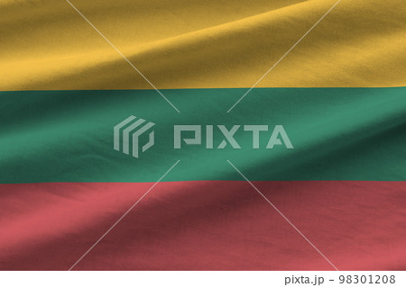 Lithuania flag with big folds waving close up under the studio light indoors. The official symbols and colors in banner 98301208