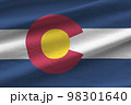 Colorado US state flag with big folds waving close up under the studio light indoors. The official symbols and colors in banner 98301640