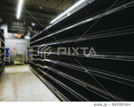 Supermarket with empty shelves of product goods Emergency situation 98306364