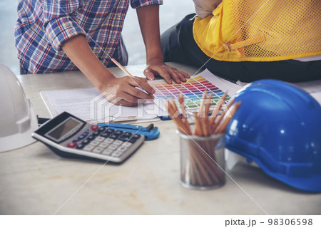 Civil Construction engineer teams shaking hands together wear work helmets worker on construction site. Foreman industry project working engineer teamwork. Two asian engineer team shake hands together Civil Construction engineer teams shaking hands together wear work helmets worker on construction site. Foreman industry project working engineer teamwork. Two asian engineer team shake hands together 98306598