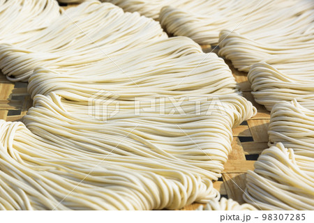 Close-up of traditional handmade noodle-making drying outdoors in Guanmiao, Tainan, Taiwan. 98307285