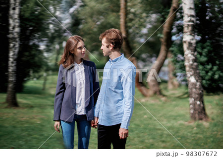 portrait of a happy couple in love on a walk. portrait of a happy couple in love on a walk. 98307672