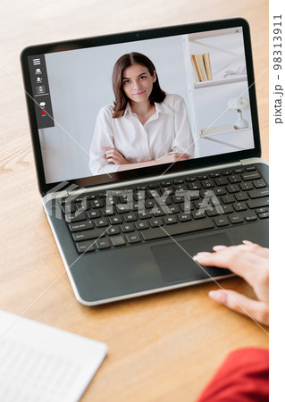 Web interview. Video chat. Remote cooperation. Female business partners discussing work online on laptop screen at digital office workplace. 98313911
