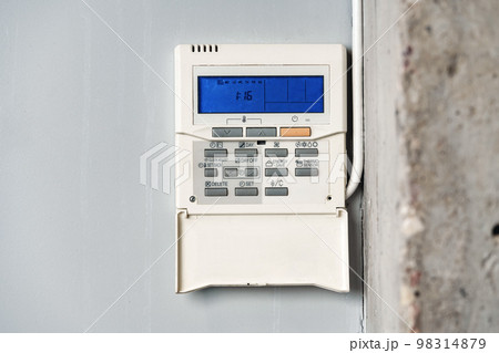 Home security alarm system remote control on the wall Home security alarm system remote control on the wall 98314879