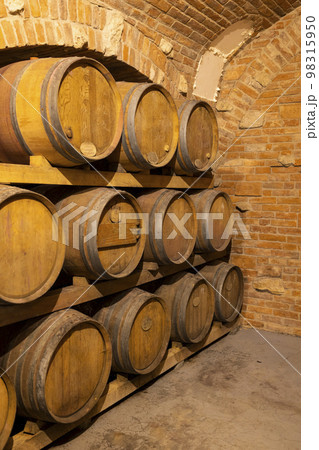 Wine cellars with barrels in Rakvice, Southern Moravia, Czech Republic Wine cellars with barrels in Rakvice, Southern Moravia, Czech Republic 98315950