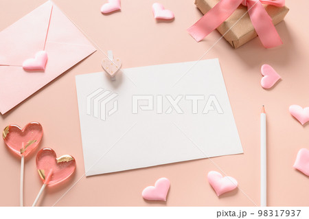 Valentine's day card with envelope and pink lollipops as heart. Valentine's day card with envelope and pink lollipops as heart. 98317937