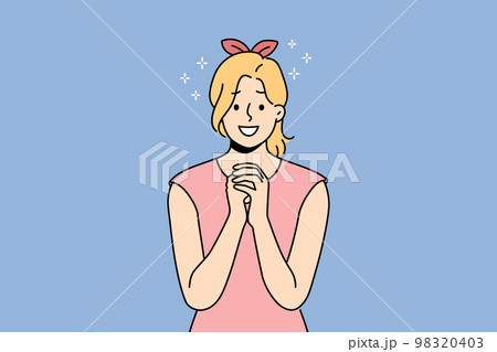 Smiling woman with hands in prayer  98320403