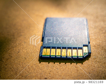 A closeup of a memory card lying on the table. A closeup of a memory card lying on the table. 98321169