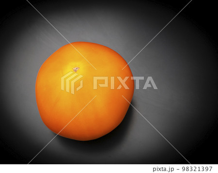 Yellow tomatoes vegetables on a black background. Yellow tomatoes vegetables on a black background. 98321397