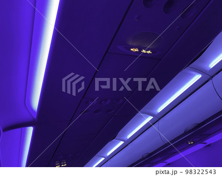 Airplane ceiling at night. No Smoking and Fasten Seat belt Sign Inside an Airplane Airplane ceiling at night. No Smoking and Fasten Seat belt Sign Inside an Airplane 98322543