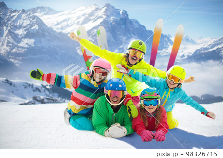 Family in winter mountains. Ski and snow vacation. 98326715