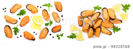 mussels with parsley lemon and peppercorns isolated on white background. Top view. Flat lay 98328588