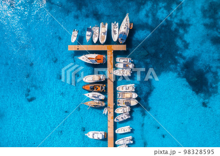 Aerial view of boats and yachts in dock at sunset in summer Aerial view of boats and yachts in dock at sunset in summer 98328595