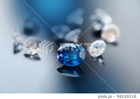 precious natural blue gemstone, blue sapphire with diamond on black background 98330316