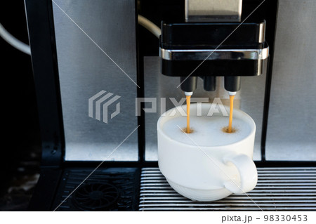 coffee machine making fresh coffee 98330453