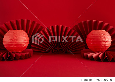 Chinese New Year product display background with lanterns and paper fan. Translation: Let ten thousand wishes come true. Chinese New Year product display background with lanterns and paper fan. Translation: Let ten thousand wishes come true. 98330516