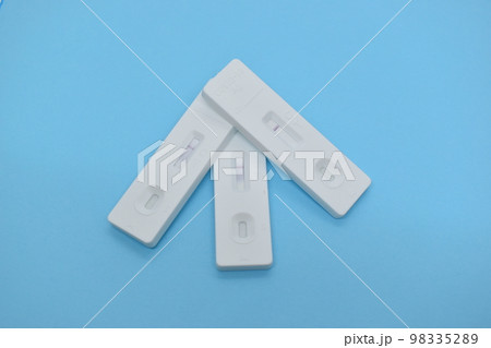 covid test kit on blue background 98335289