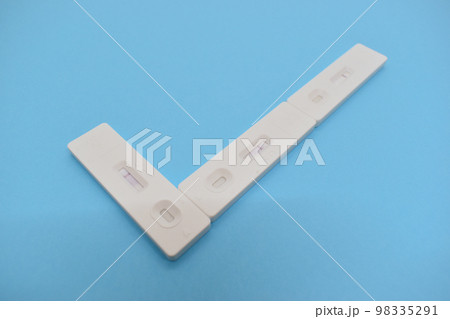 covid test kit on blue background 98335291