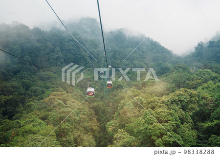 View of Ba Na Hills Mountain in the fog from Cable car. Landmark and popular. Da Nang, Vietnam and Southeast Asia travel concept View of Ba Na Hills Mountain in the fog from Cable car. Landmark and popular. Da Nang, Vietnam and Southeast Asia travel concept 98338288