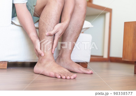 Man having leg pain due to Ankle Sprains or Achilles Tendonitis and Shin Splints ache. injuries, health and medical concept Man having leg pain due to Ankle Sprains or Achilles Tendonitis and Shin Splints ache. injuries, health and medical concept 98338577