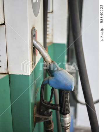 Close up of diesel and petrol fuel pistols at a gas station. Close up of diesel and petrol fuel pistols at a gas station. 98340222