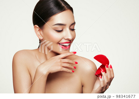 Young beautiful woman with wedding ring gift Young beautiful woman with wedding ring gift 98341677