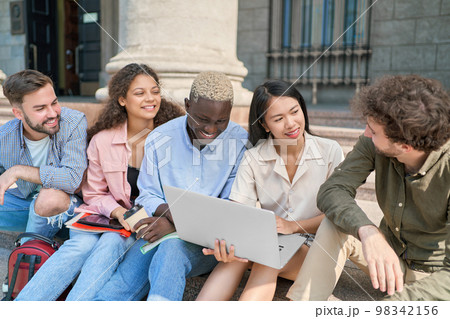 Group of student siting in campus having lunch brake. Group of student siting in campus having lunch brake. 98342156