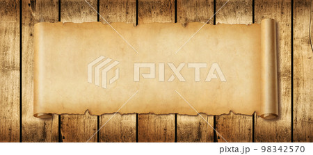 Old paper horizontal banner. Parchment scroll on a wood board 98342570