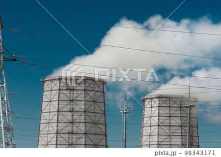 Toxic smoke is released from the cooling tower into the atmosphere and pollutes the environment, air and atmosphere. Operation of the industrial heat and power plant 98343171