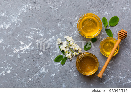 honey jar with acacia flowers and leaves. fresh honey top view flat lay 98345512