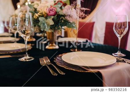 Beautiful table setting with floral decor for a holiday 98350216
