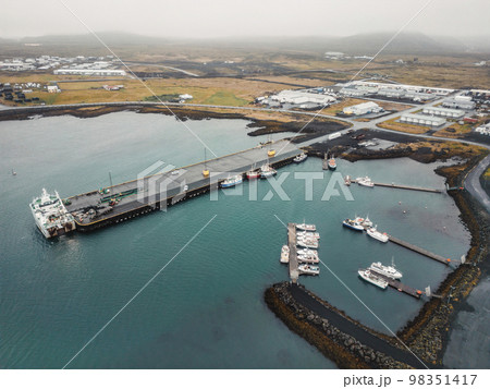Small fishing boats docked on the piers at Grindavik fishing town in Iceland Small fishing boats docked on the piers at Grindavik fishing town in Iceland 98351417