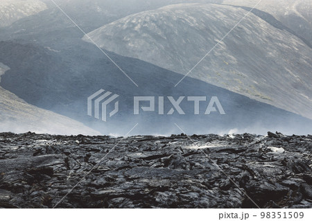 Steam coming of still hot lava rocks from 2022 Meradalir erruption - Iceland Steam coming of still hot lava rocks from 2022 Meradalir erruption - Iceland 98351509