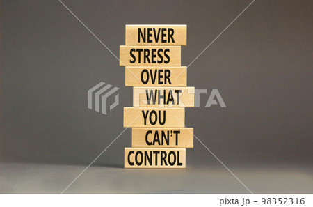Never stress symbol. Concept words Never stress what you can not control on wooden blocks. Beautiful grey background copy space. Business control motivational never stress concept. 98352316