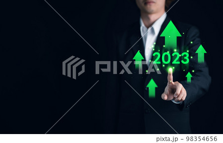 Business growing from 2022 to 2023 year. Businessman hand touch green arrow increasing technical graph and up arrow for trader analysis. Stock, Cryptocurrency chart trader, trading, investment, ROI Business growing from 2022 to 2023 year. Businessman hand touch green arrow increasing technical graph and up arrow for trader analysis. Stock, Cryptocurrency chart trader, trading, investment, ROI 98354656