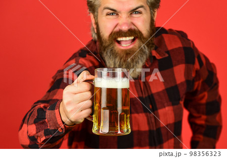 enjoying a beer. confident bartender. barman in bar. resting at pub. Cheers. sport bar. trying a new beer. brutal hipster drink beer. mature bearded man hold beer glass. mug of alcohol beverage enjoying a beer. confident bartender. barman in bar. resting at pub. Cheers. sport bar. trying a new beer. brutal hipster drink beer. mature bearded man hold beer glass. mug of alcohol beverage 98356323