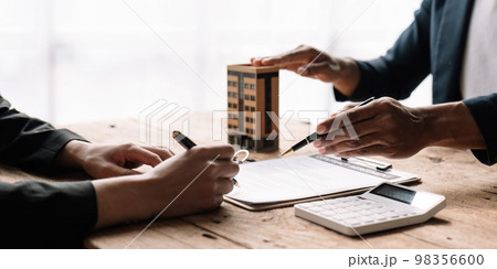 Real estate agent offer hand for customer sign agreement contract signature for buy or sell house. Real estate concept contact agreement concept. Real estate agent offer hand for customer sign agreement contract signature for buy or sell house. Real estate concept contact agreement concept. 98356600