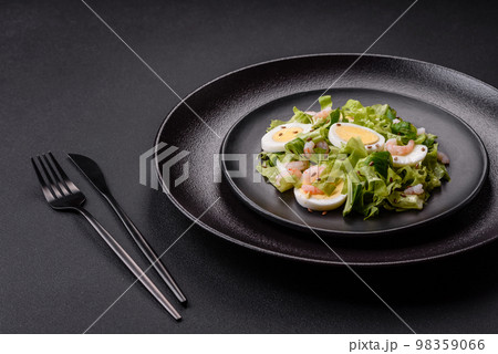 Delicious fresh healthy salad with shrimp, egg, lettuce and flax seeds Delicious fresh healthy salad with shrimp, egg, lettuce and flax seeds 98359066