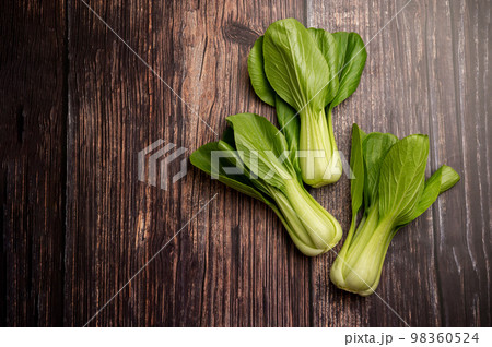 Celery cabbage or peach choi, asian baby salad leaves on wooden background, copy space 98360524