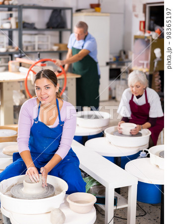 girl works with potter`s wheel 98365197