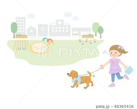 公園で犬の散歩をしている女の子 98365416