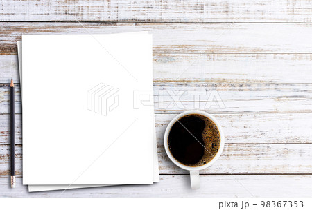 Top view with white paper,pencil and cup of coffee on wooden table 98367353