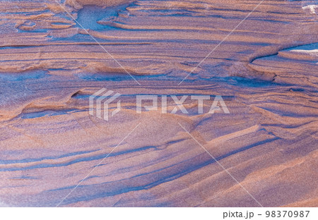 Natural sand pattern created by wind, shore of the dunes Natural sand pattern created by wind, shore of the dunes 98370987