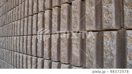Sturdy beige and gray cut stone wall, seamless lined up Sturdy beige and gray cut stone wall, seamless lined up 98372078