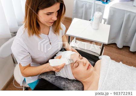 Cropped shot of a woman getting ultrasound cavitation treatment 98372291