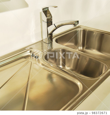 Interior of modern kitchen and stainless steel sink, tap and drain 98372671