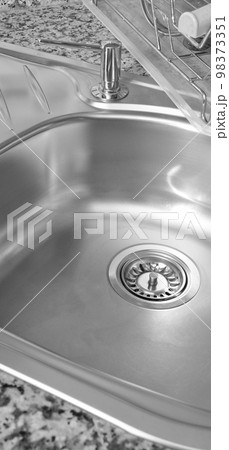 Interior of modern kitchen and stainless steel sink, tap and drain Interior of modern kitchen and stainless steel sink, tap and drain 98373351