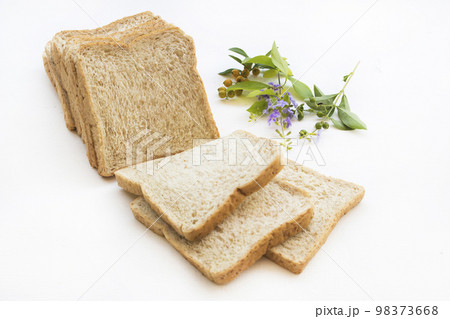 slice of bread bakery dessert with flowers arrangement flat lay style 98373668