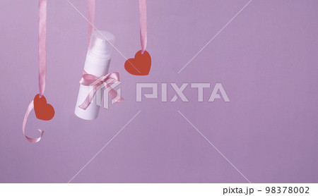 Flying red paper heart on pink background. Valentine's Day. Symbol of love. Copy space. 98378002